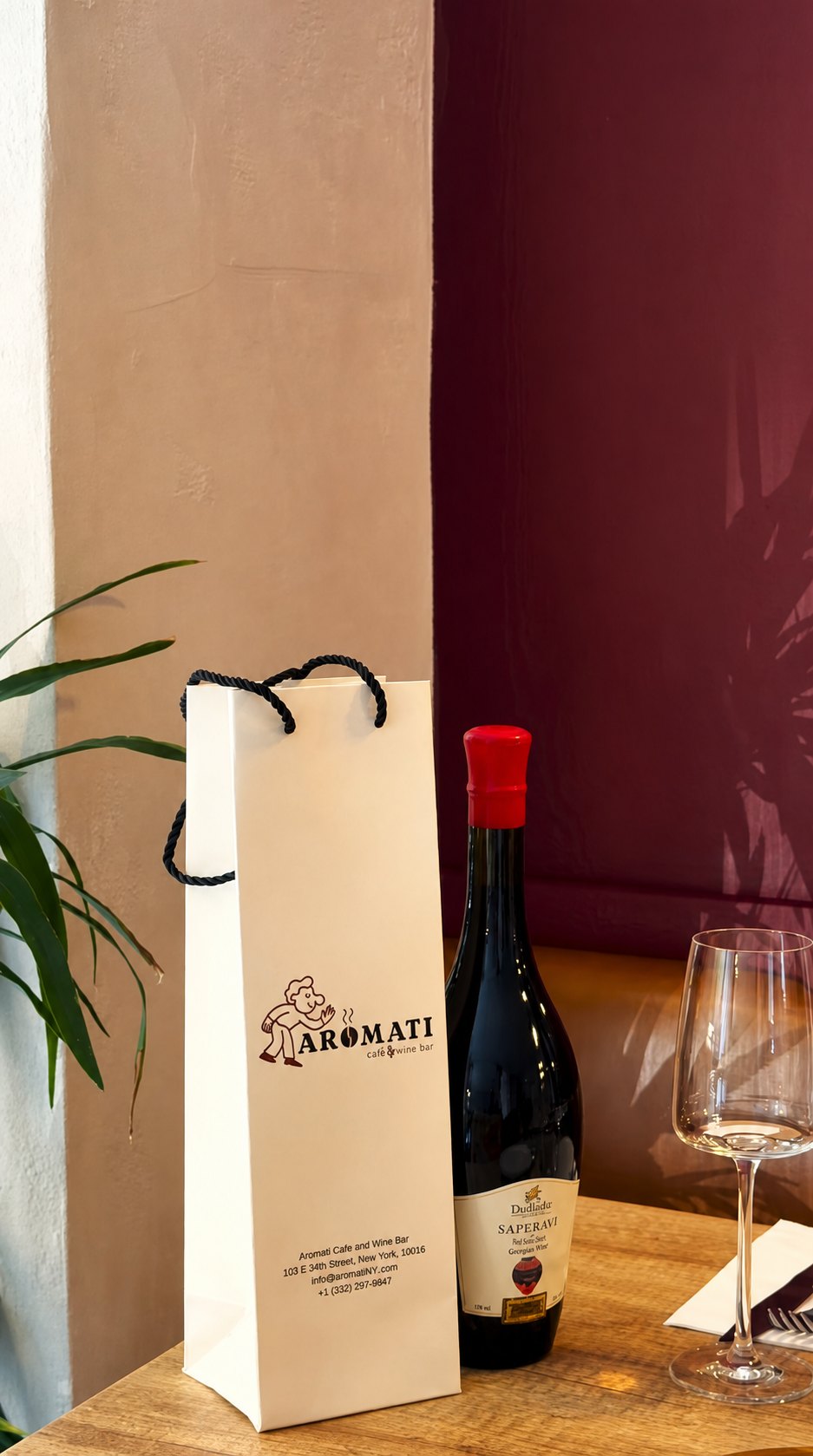 A bottle of Saperavi with an Aromati wine bag