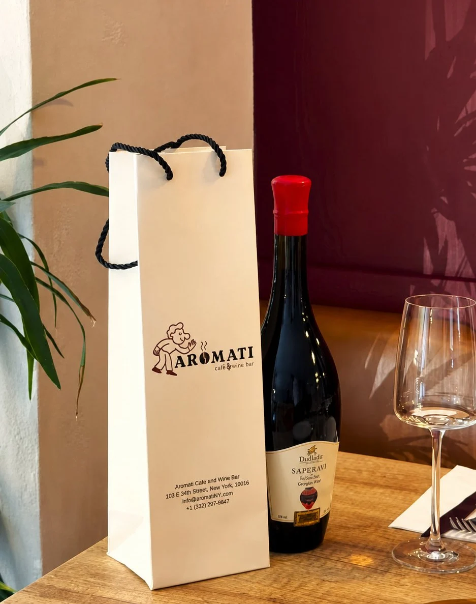 A bottle of Saperavi with an Aromati wine bag