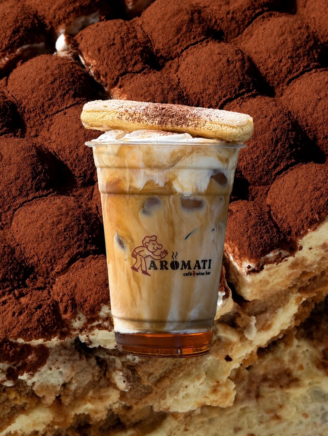 Tiramisu latte in a branded Aromati cup