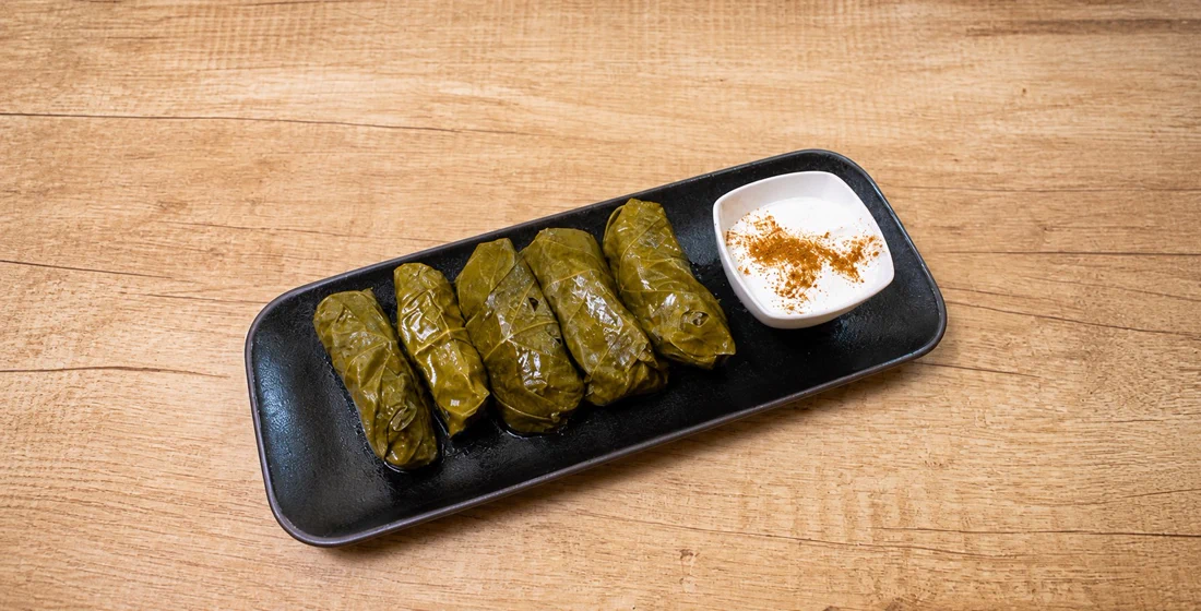Tolma — grape leaves with garlic sour cream