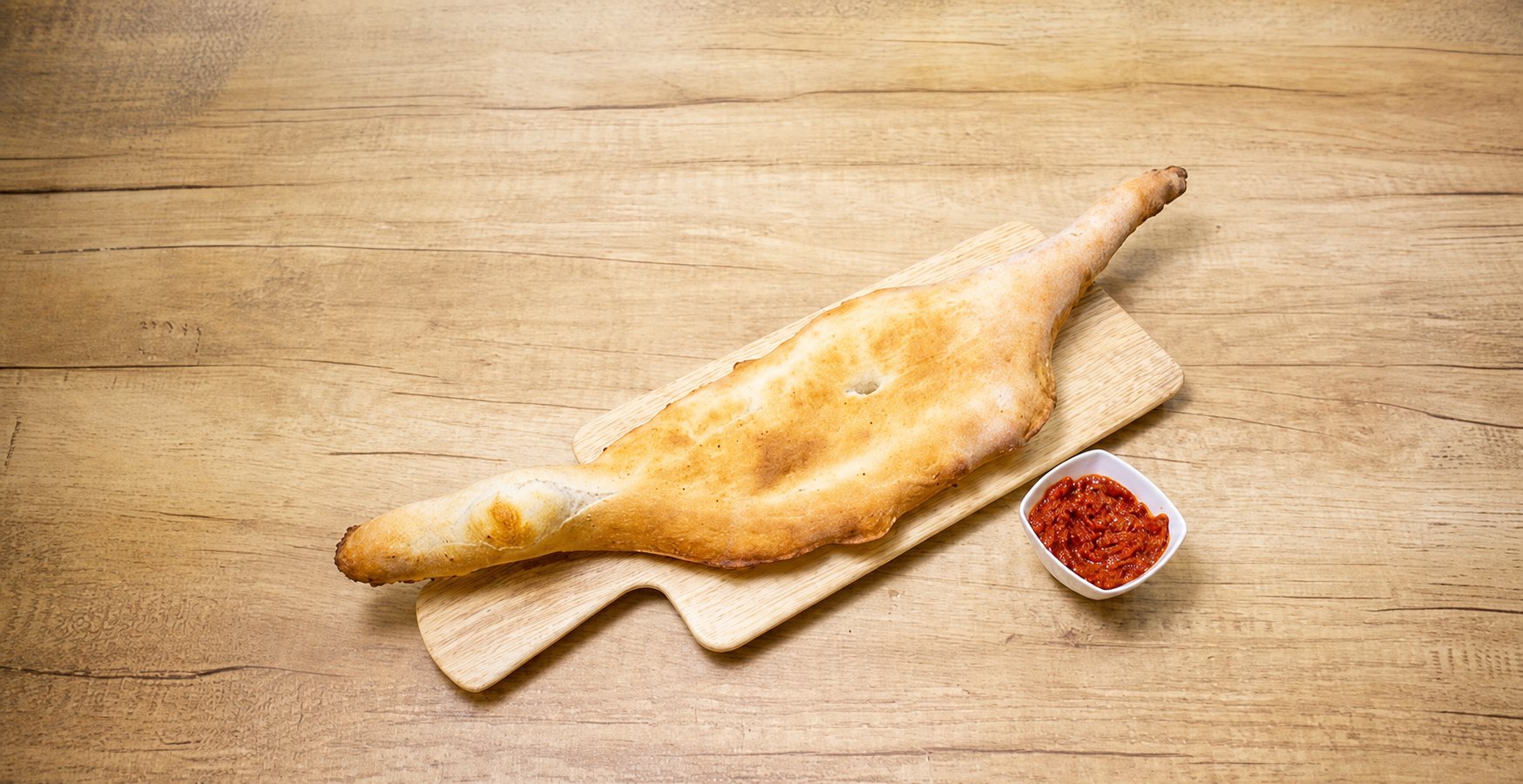 Shotis puri, canoe-shaped Georgian bread with ajika